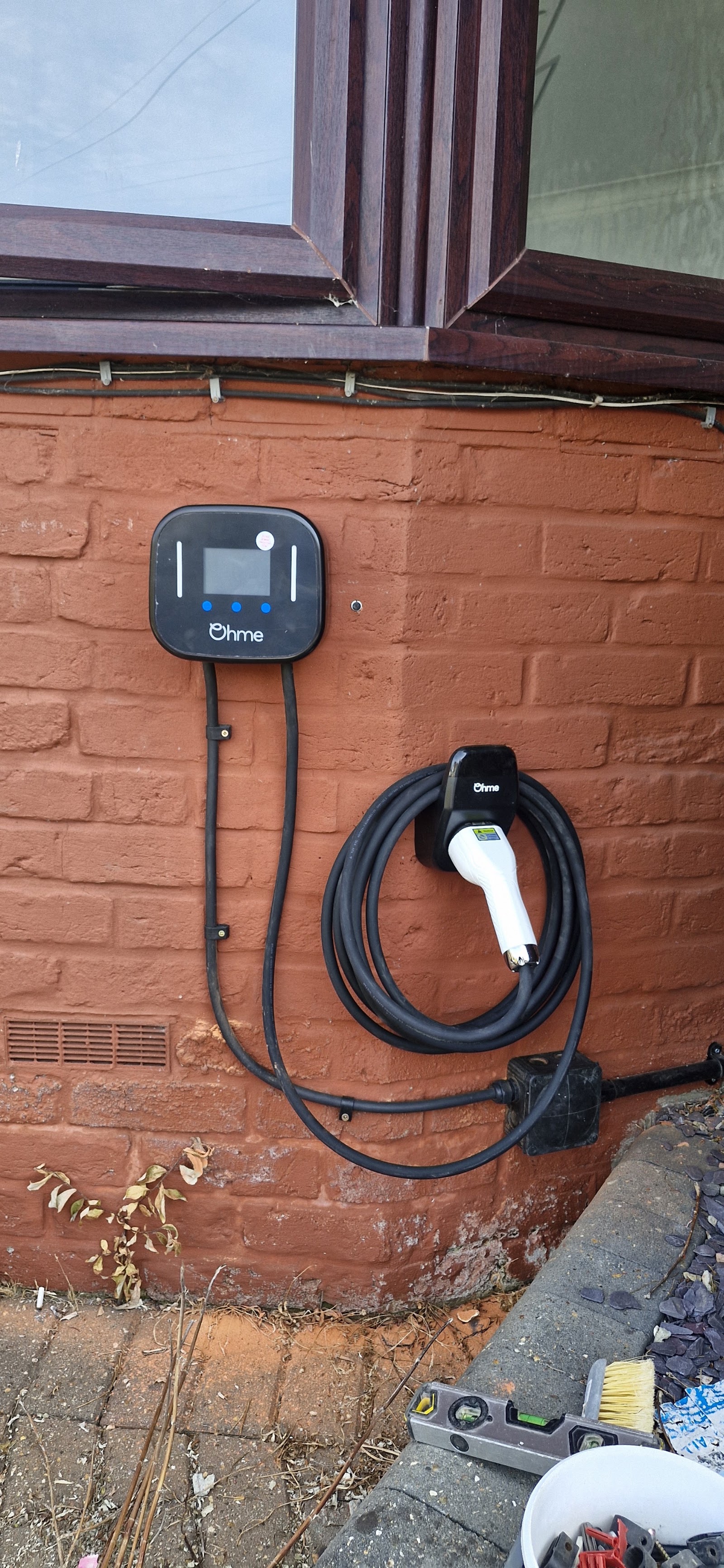 Ohme home EV charger installed on a brick wall in Southampton
